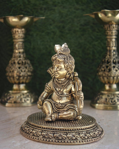 Rigvedaa™ brass Ram Lalla idol featuring intricate Bal Ram details on a circular base for home temple worship