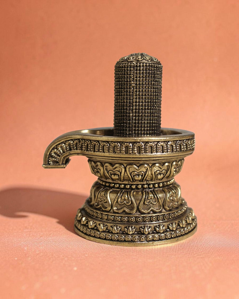 Rigvedaa brass 1008 lingam shivling murti with intricate carvings on ornate base, golden finish, 4.50 inches.