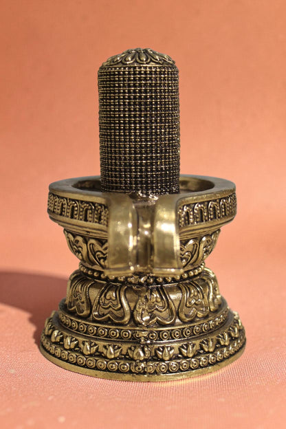 Rigvedaa brass 1008 lingam shivling murti with intricate carvings on ornate base, 4.50 inches, for pooja room or meditation space.