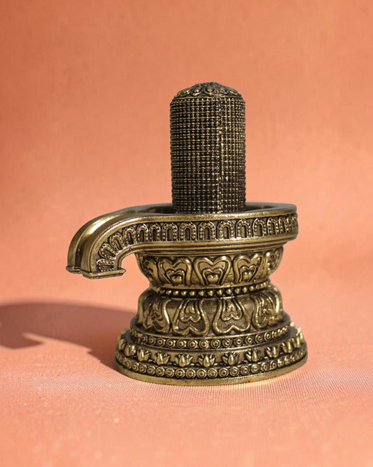 Rigvedaa brass 1008 lingam shivling murti, intricately carved with miniature lingams on an ornate base, golden finish.