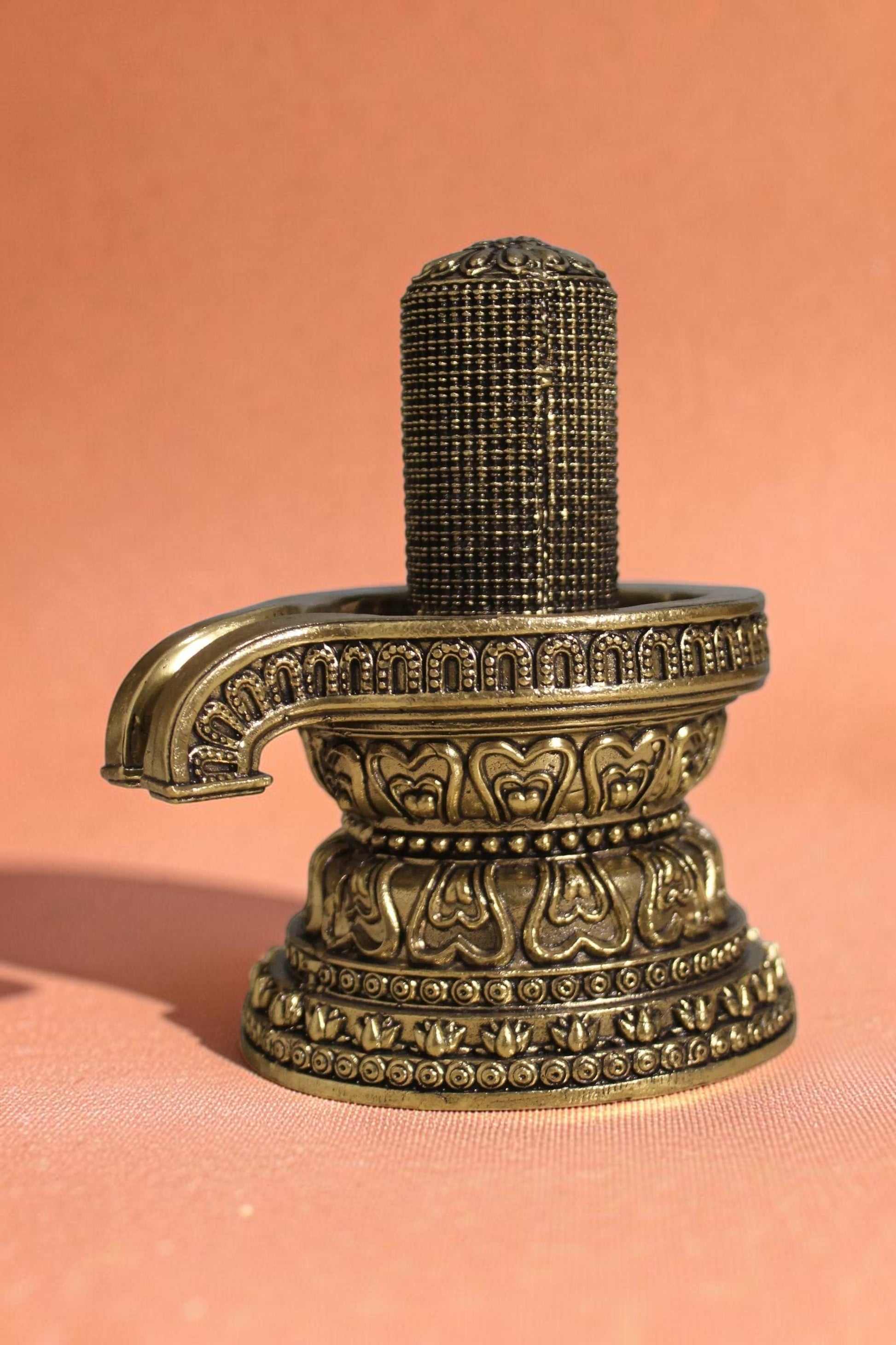 Rigvedaa brass 1008 lingam shivling murti, intricately carved with miniature lingams on an ornate base, golden finish.