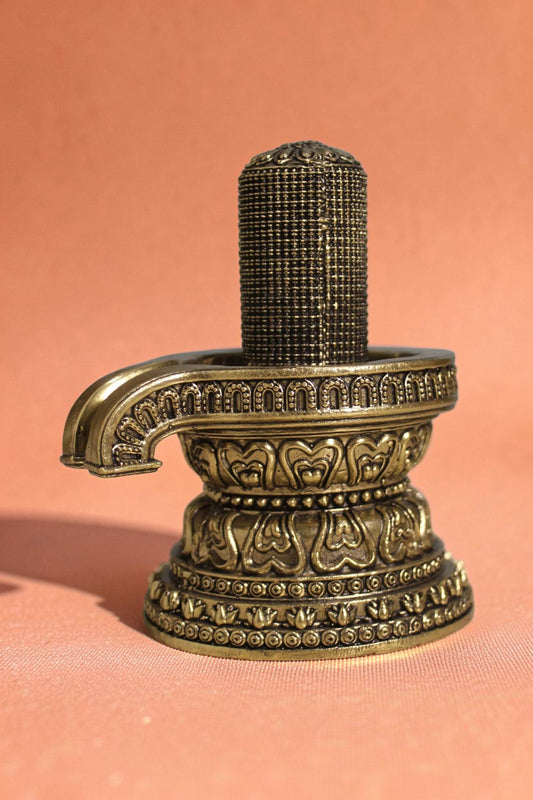 Rigvedaa brass 1008 lingam shivling murti, intricately carved with miniature lingams on an ornate base, golden finish.