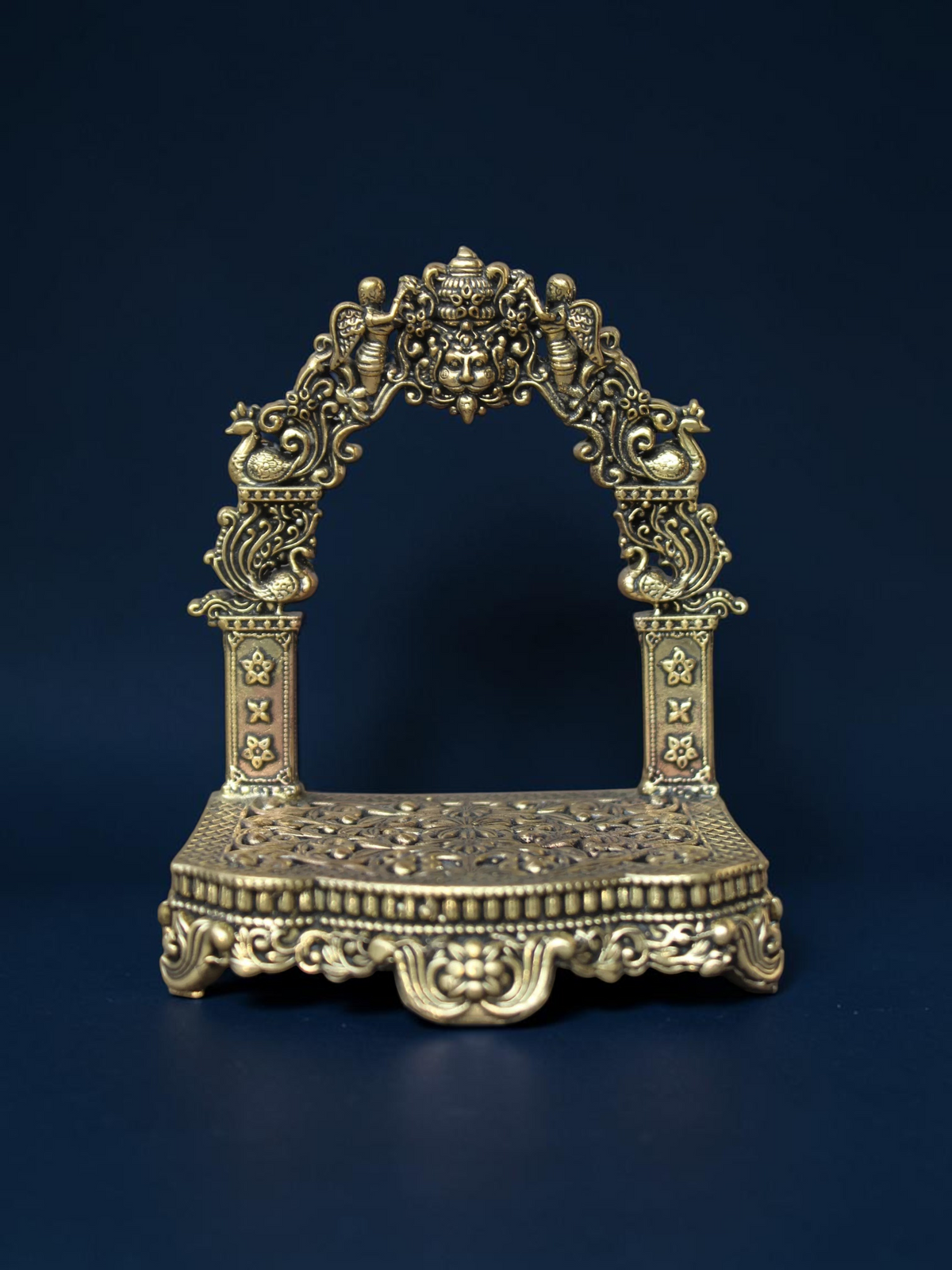 Rigvedaa™ brass Singhasan throne with ornate Prabhavali arch and floral embossed pedestal for deity idols