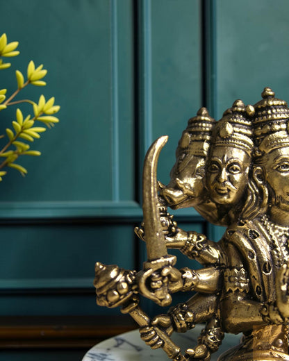 Rigvedaa™ Brass Sitting Panchmukhi Hanuman Statue with five faces and multiple arms holding weapons, detailed golden finish.