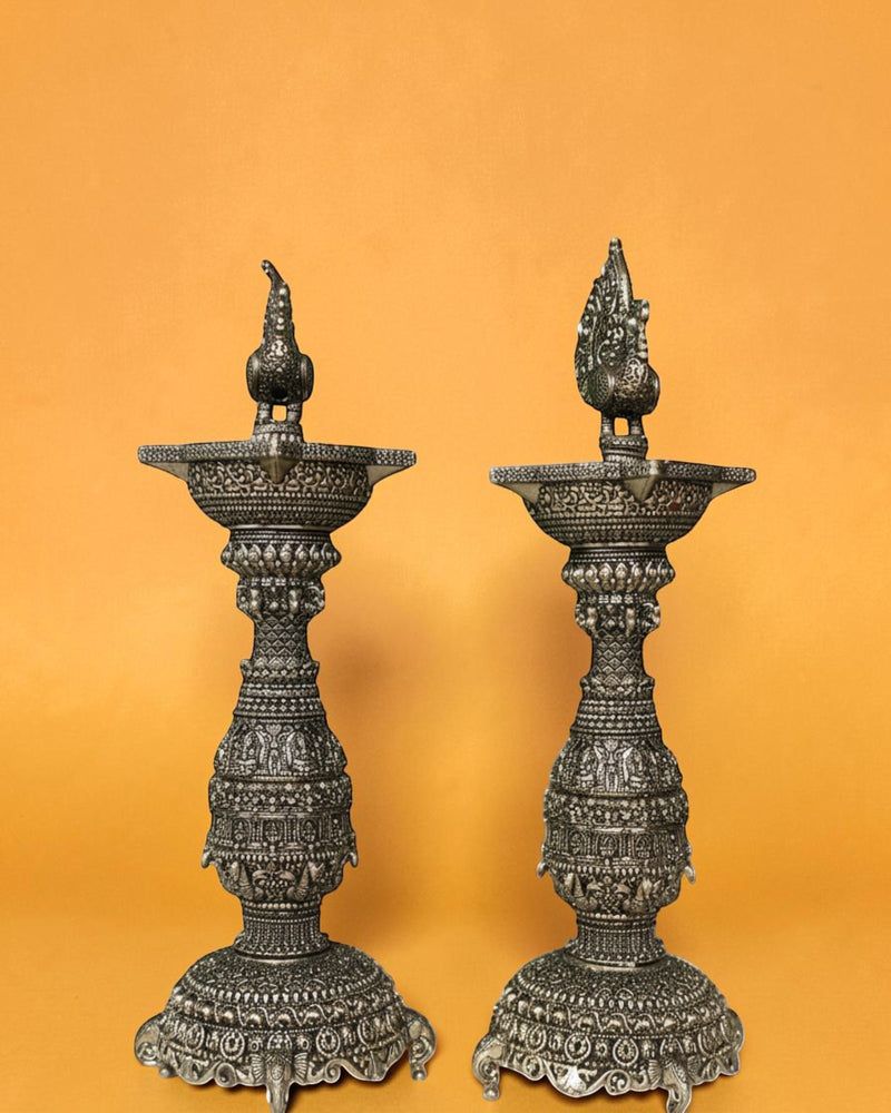 Rigvedaa brass swan diya stand with intricate carvings, antique gold finish, 12 inches tall, ideal for pooja and festivals.