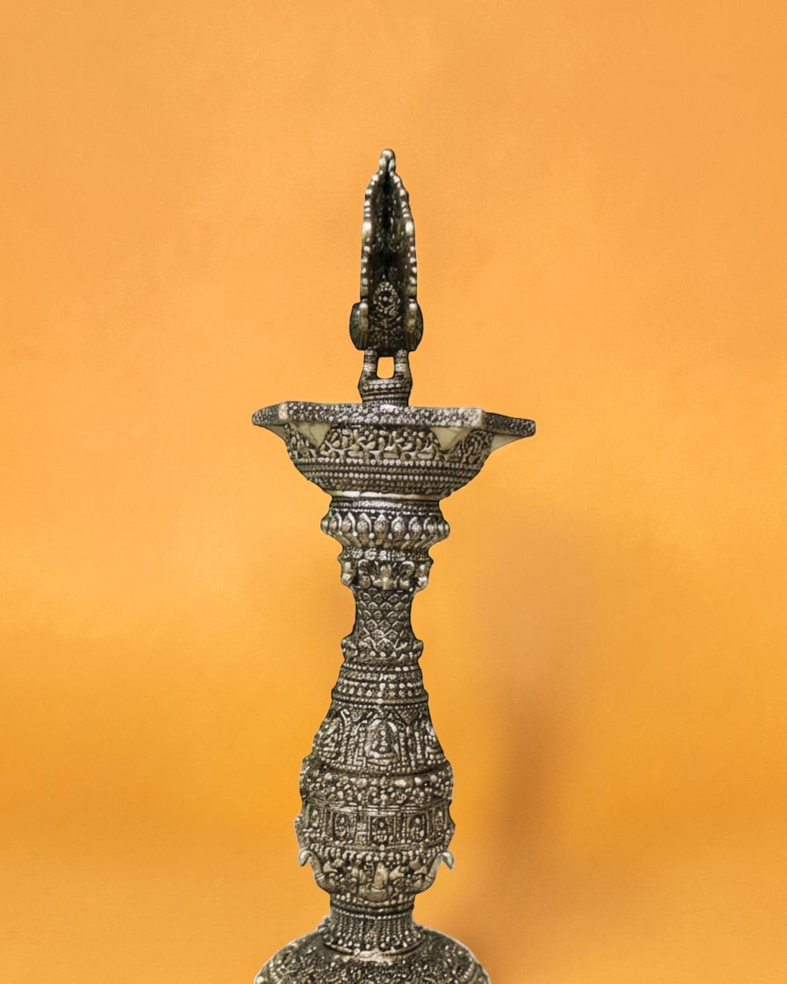 Rigvedaa brass swan diya stand with intricate carvings, antique gold finish, 12 inches tall, for pooja and decor.