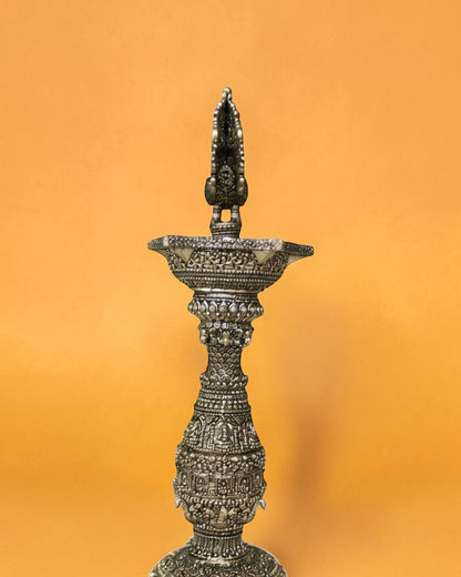 Rigvedaa brass swan diya stand with intricate carvings, antique gold finish, 12 inches tall, for pooja and decor.