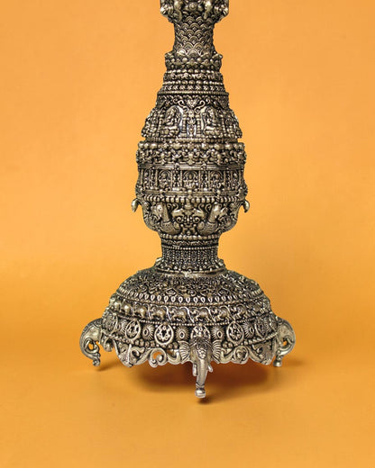 Rigvedaa brass swan diya stand with intricate carvings and antique gold finish, 12 inches tall, ideal for pooja and festivals.