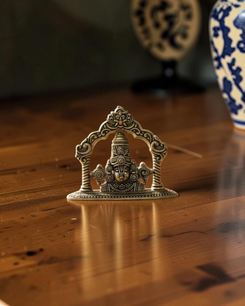 Rigvedaa brass Tirupati Balaji face murti with ornate crown and detailed ornaments, ideal for home mandir and gifting.