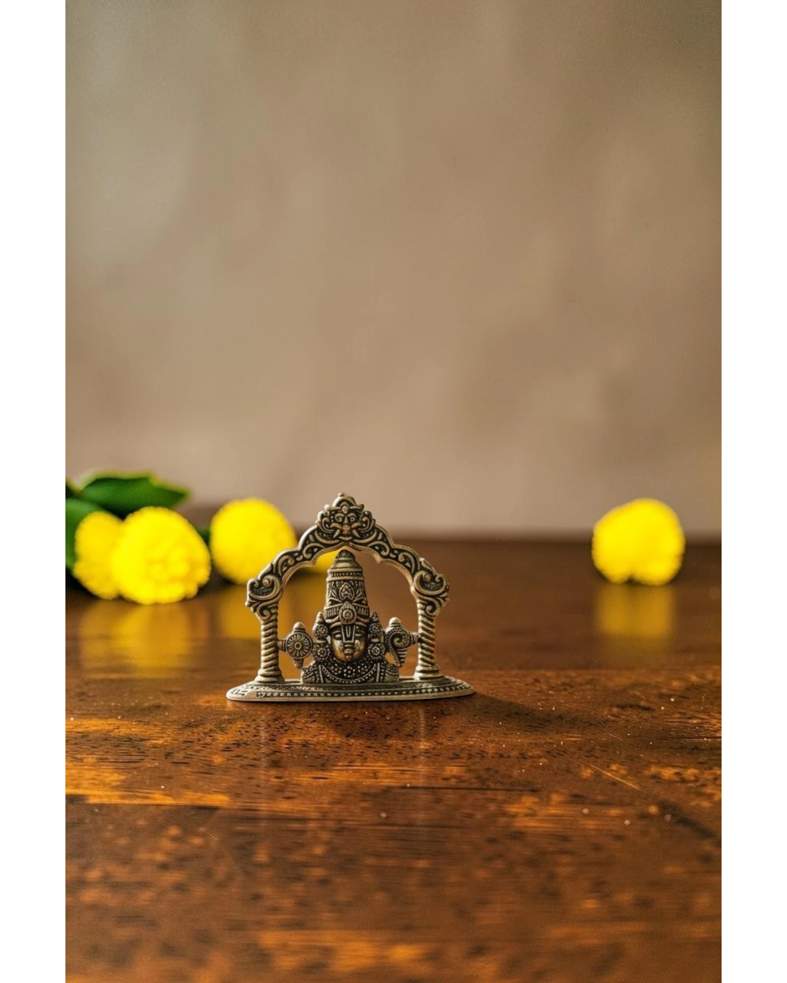 Rigvedaa brass Tirupati Balaji face murti with ornate crown and detailed ornaments, ideal for home mandir and gifting.