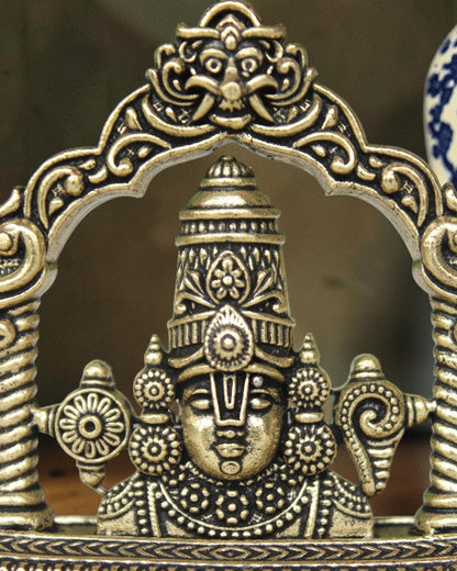 Rigvedaa brass Tirupati Balaji face murti with ornate crown and detailed ornaments, ideal for home mandir and gifting.