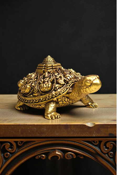 Rigvedaa™ golden brass tortoise figurine with intricate Ashta Lakshmi and Shree Yantra carvings, symbolizing prosperity and good fortune.