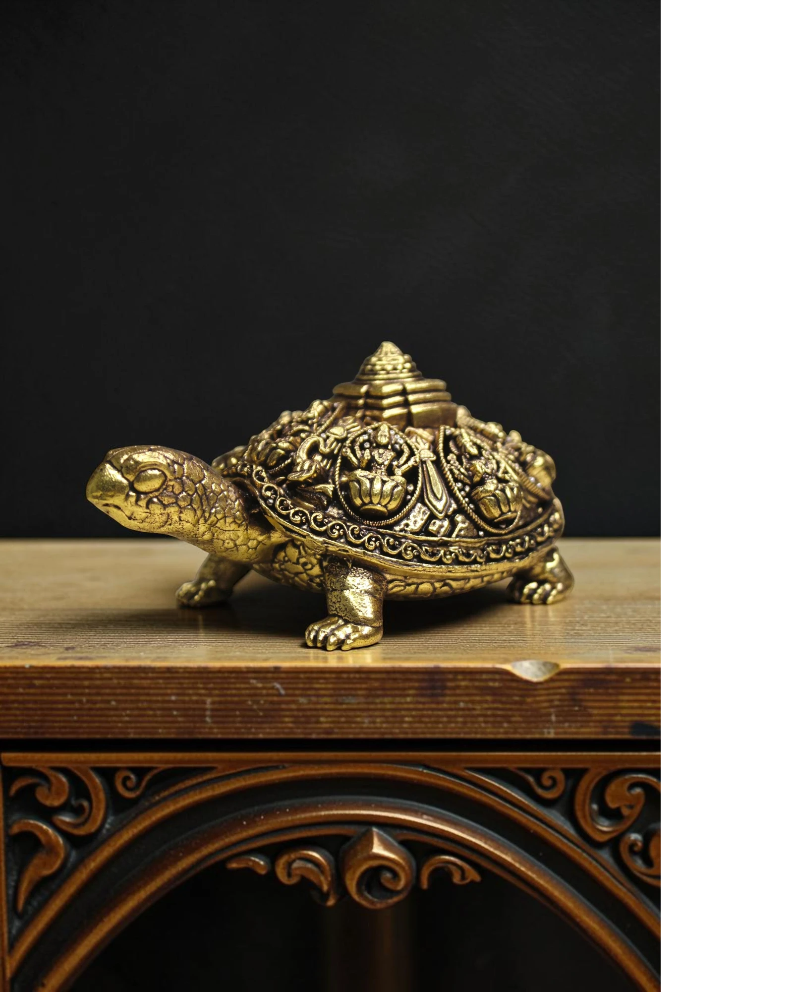 Rigvedaa™ golden brass tortoise figurine with intricate Ashta Lakshmi and Shree Yantra carvings, symbolizing prosperity and good fortune.