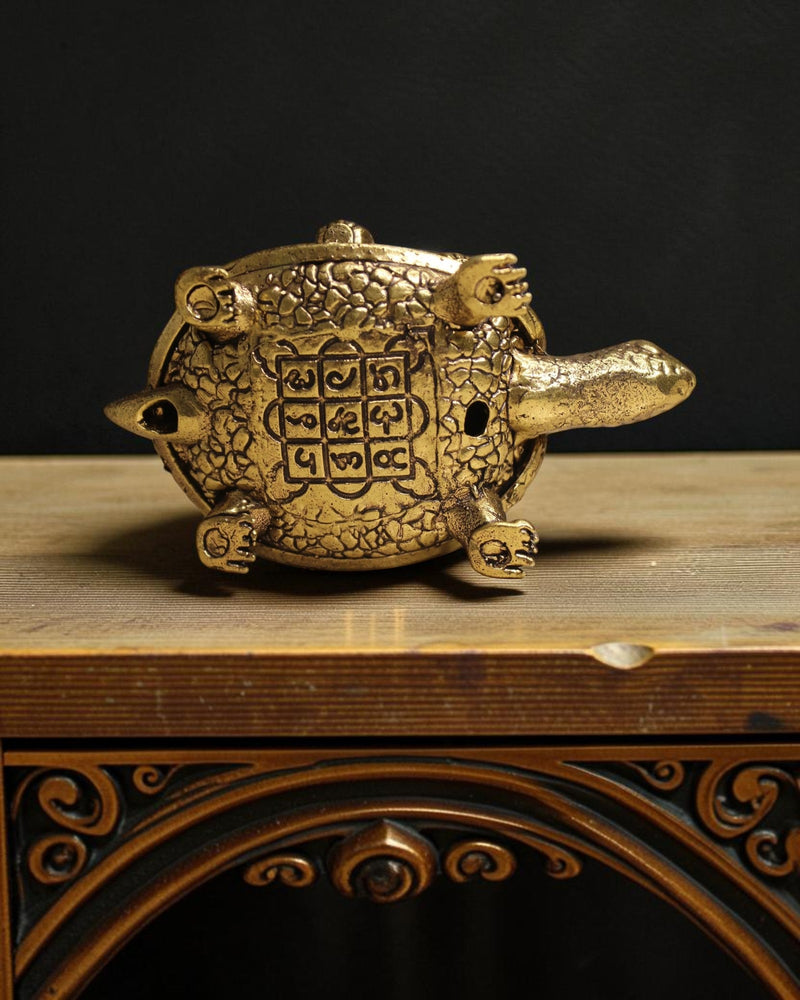 Rigvedaa™ brass tortoise figurine with intricate detailing and Shree Yantra engraving on its shell, representing Vastu and Feng Shui for prosperity.