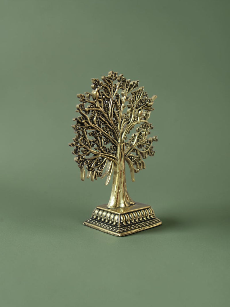 Rigvedaa™ brass Tree of Life tabletop sculpture with intricate branches, leaves, and bird accents on a square base.