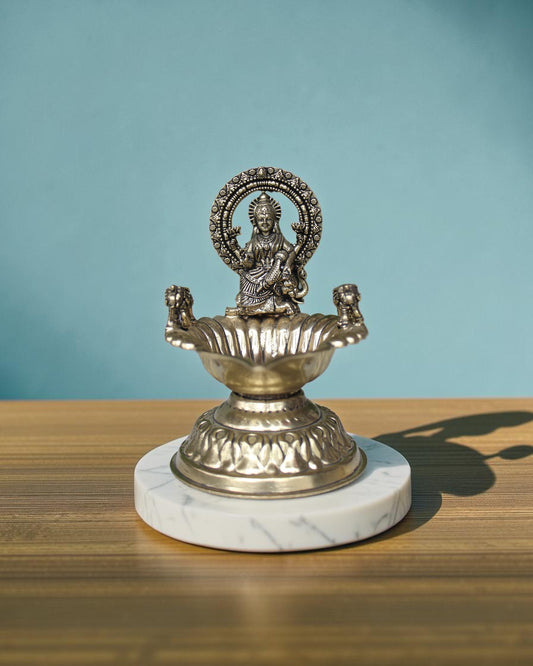 Rigvedaa™ Handcrafted brass Gaj Laxmi diya oil lamp with intricate details and antique finish, 4.5 inches.