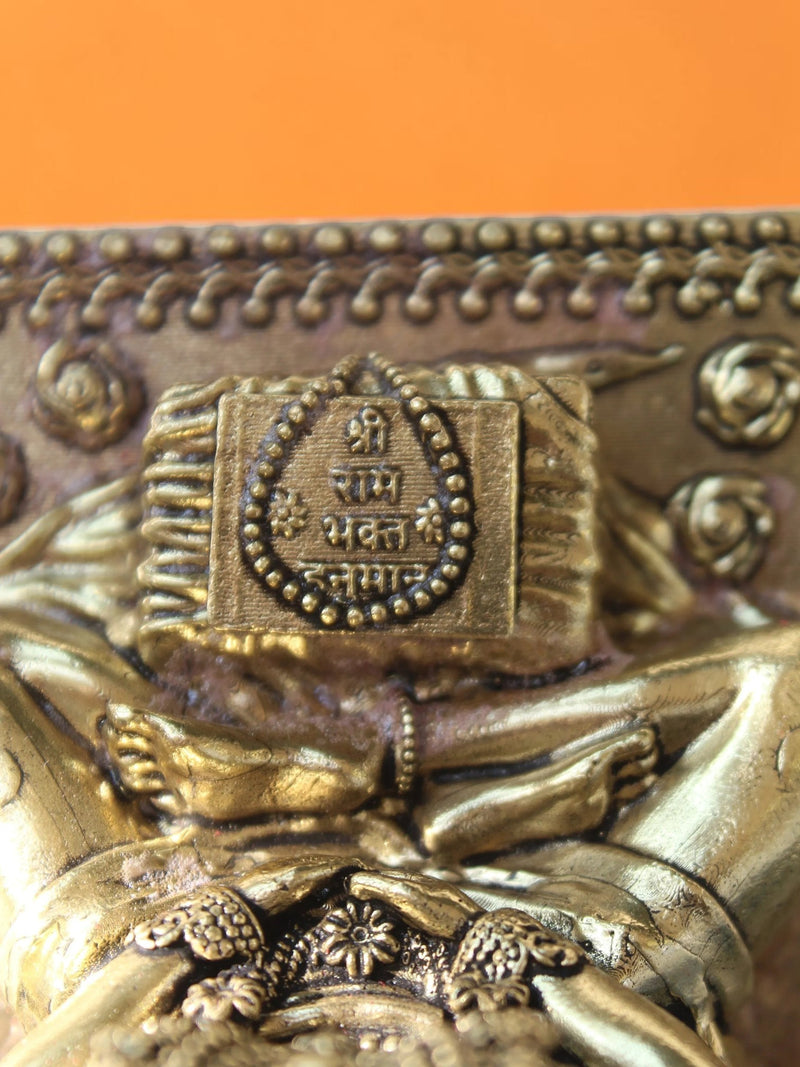 Rigvedaa™ brass Lord Hanuman statue detail showing the sacred Ram Sadhna inscription on his meditative posture