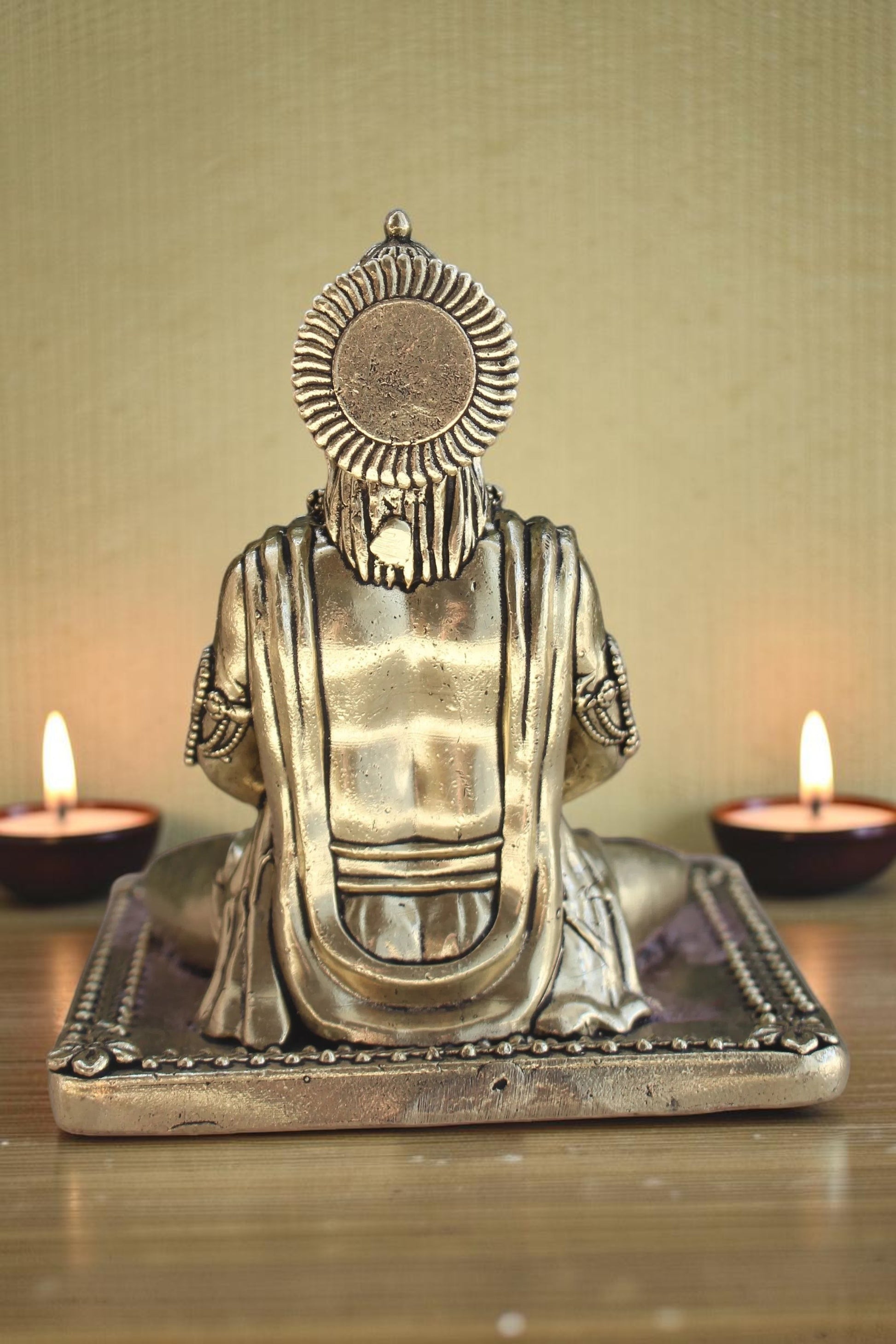 Rigvedaa brass idol of Lord Hanuman meditating in Ram Sadhna posture, seated on a decorative base.