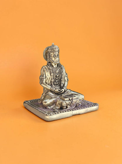 Rigvedaa™ 3.75-inch brass Lord Hanuman statue in a serene meditative posture with intricate jewelry and golden patina.