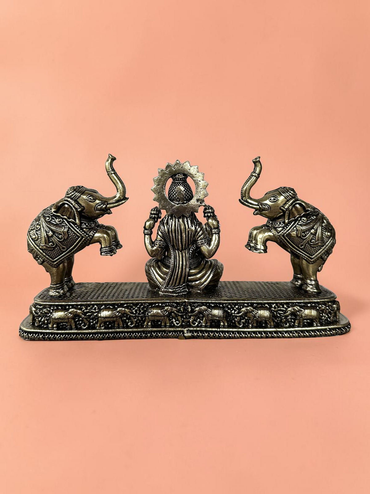 Rigvedaa™ Goddess Lakshmi and elephants decorative figurine in antique bronze finish with intricate base detailing.