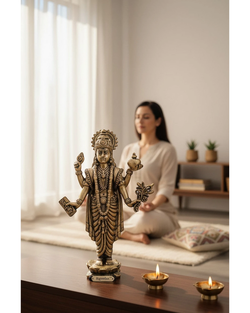 Rigvedaa brass idol of Lord Dhanvantri, God of Ayurveda, holding a pot and herbs, for health and healing.