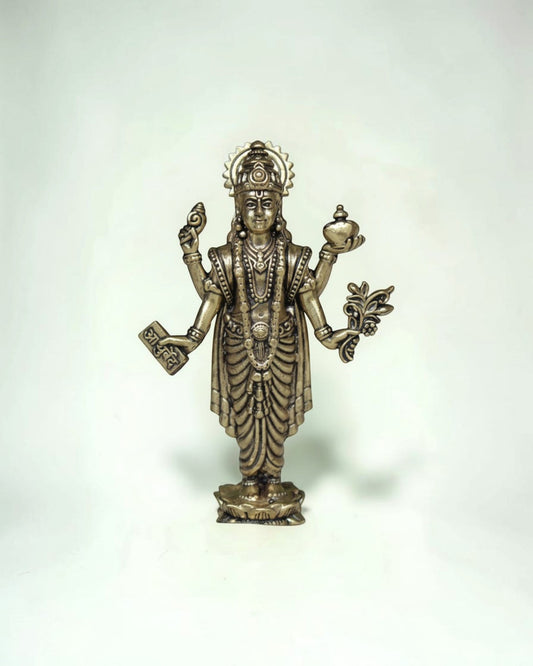 Rigvedaa™ Lord Dhanvantri brass idol, God of Ayurveda, holding a pot and herbs for health and healing.