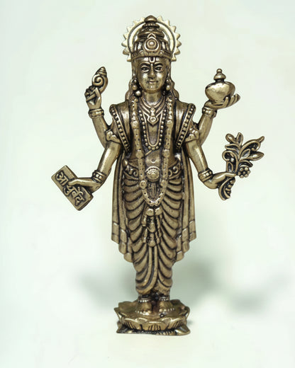 Rigvedaa™ Lord Dhanvantri brass idol, God of Ayurveda, holding a pot and herbs for health and healing.