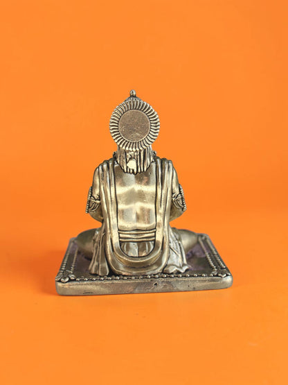 Back view of a Rigvedaa™ brass Lord Hanuman statue in a meditative posture with detailed crown and golden patina.