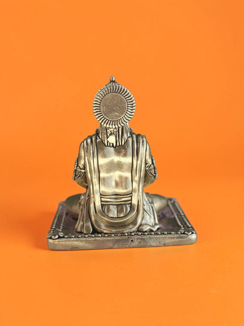Back view of a Rigvedaa™ brass Lord Hanuman statue in a meditative posture with detailed crown and golden patina.