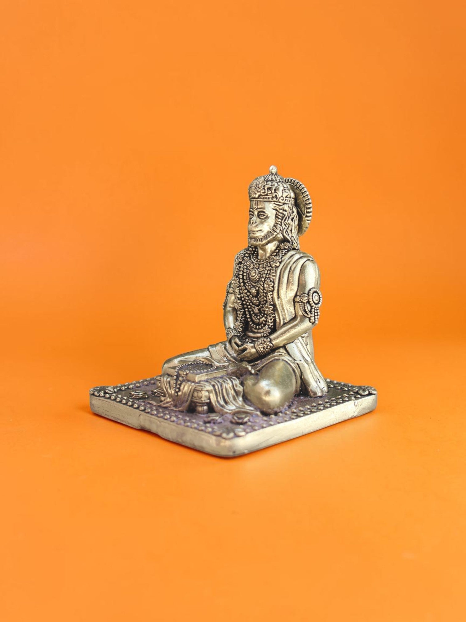 Rigvedaa™ 3.75-inch brass Lord Hanuman statue in a meditative Ram Sadhna posture with intricate golden detailing.