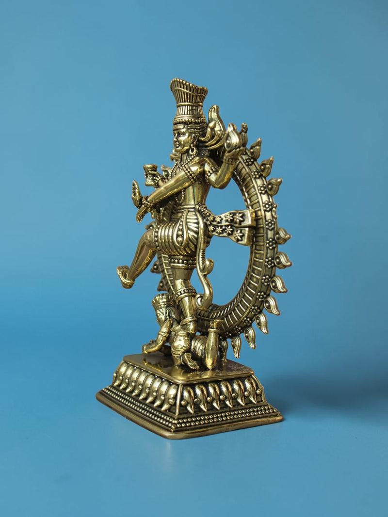 Rigvedaa™ golden brass Nataraja statue showing intricate details of Lord Shiva dancing within the ring of fire