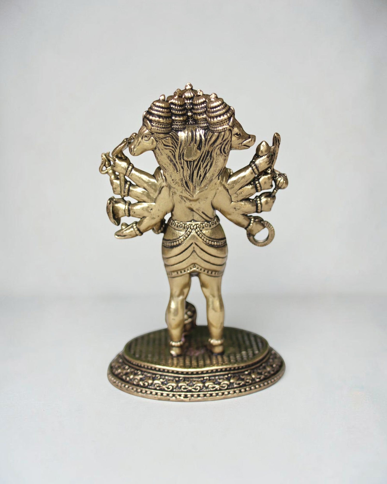 Rigvedaa Panchmukhi Balaji idol, a five-faced brass sculpture with antique finish, intricate detailing, and multiple arms, standing on an ornate base.