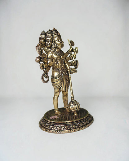 Rigvedaa Panchmukhi Balaji idol in brass with antique finish. Five-faced deity with multiple arms holding various attributes, standing on an ornate base.