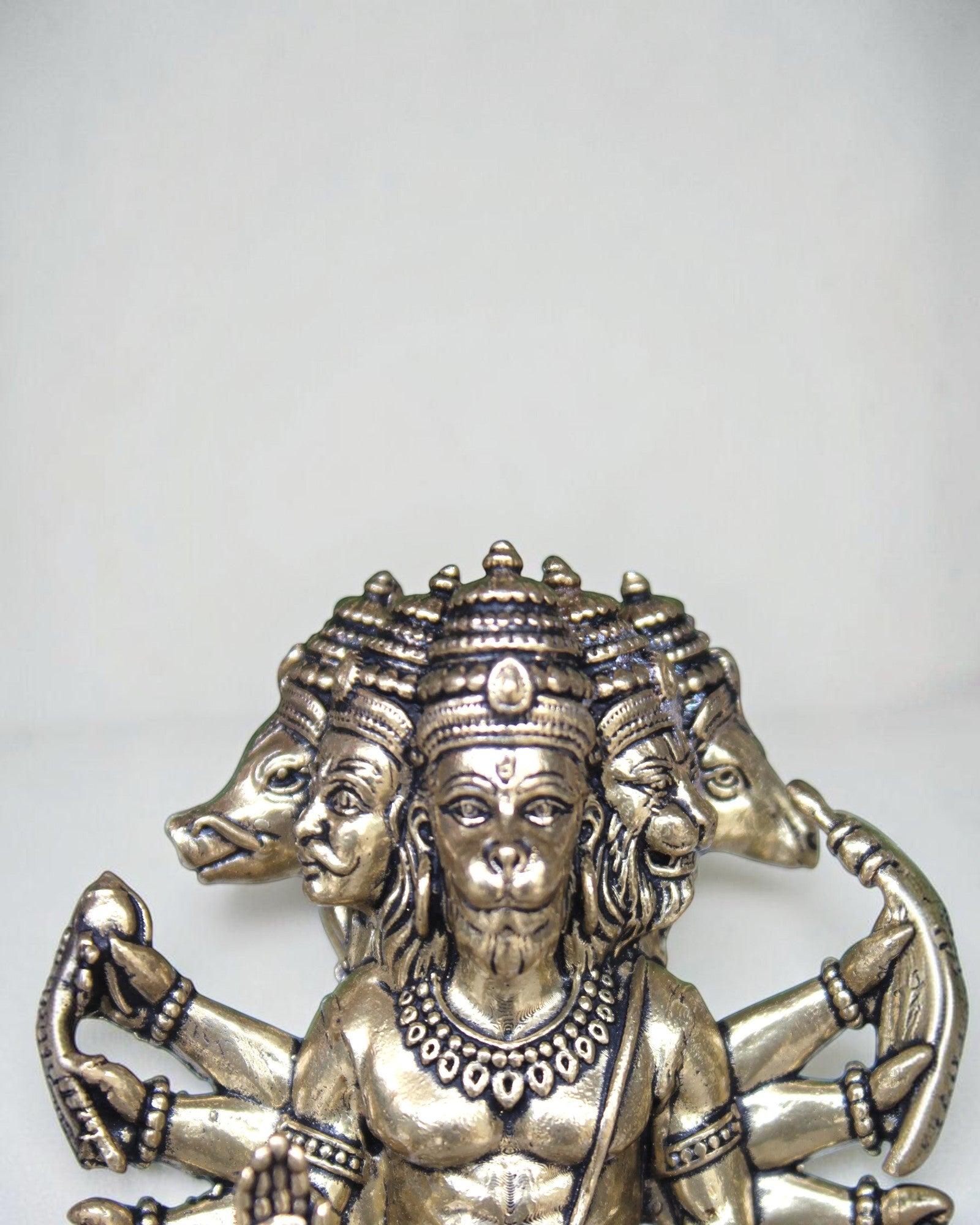 Rigvedaa Panchmukhi Balaji idol, a brass sculpture with five faces and multiple arms, antique finish, intricate detailing.