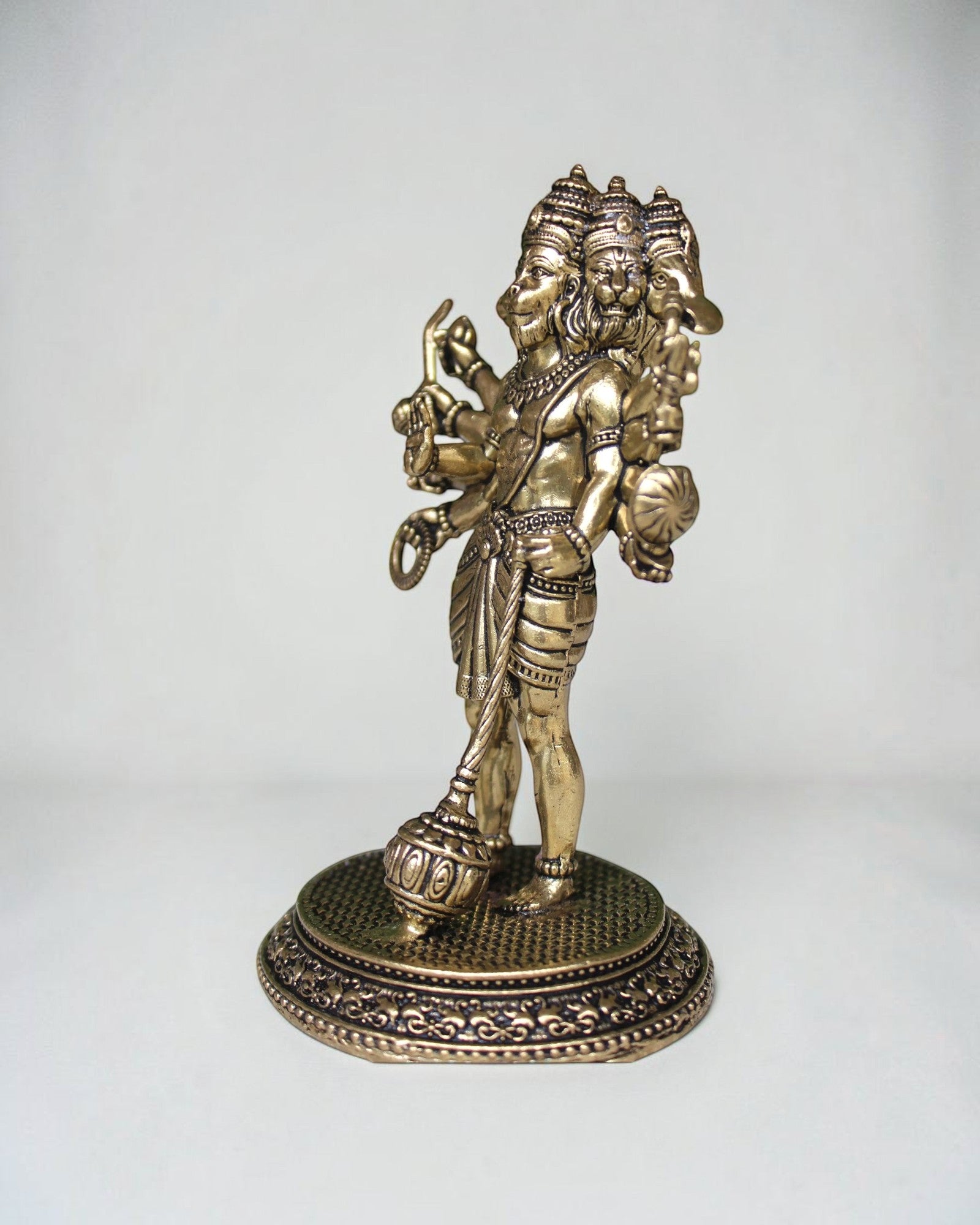 Rigvedaa Standing Panchmukhi Balaji Idol, premium brass sculpture with five faces, antique finish, holding a mace and other attributes.