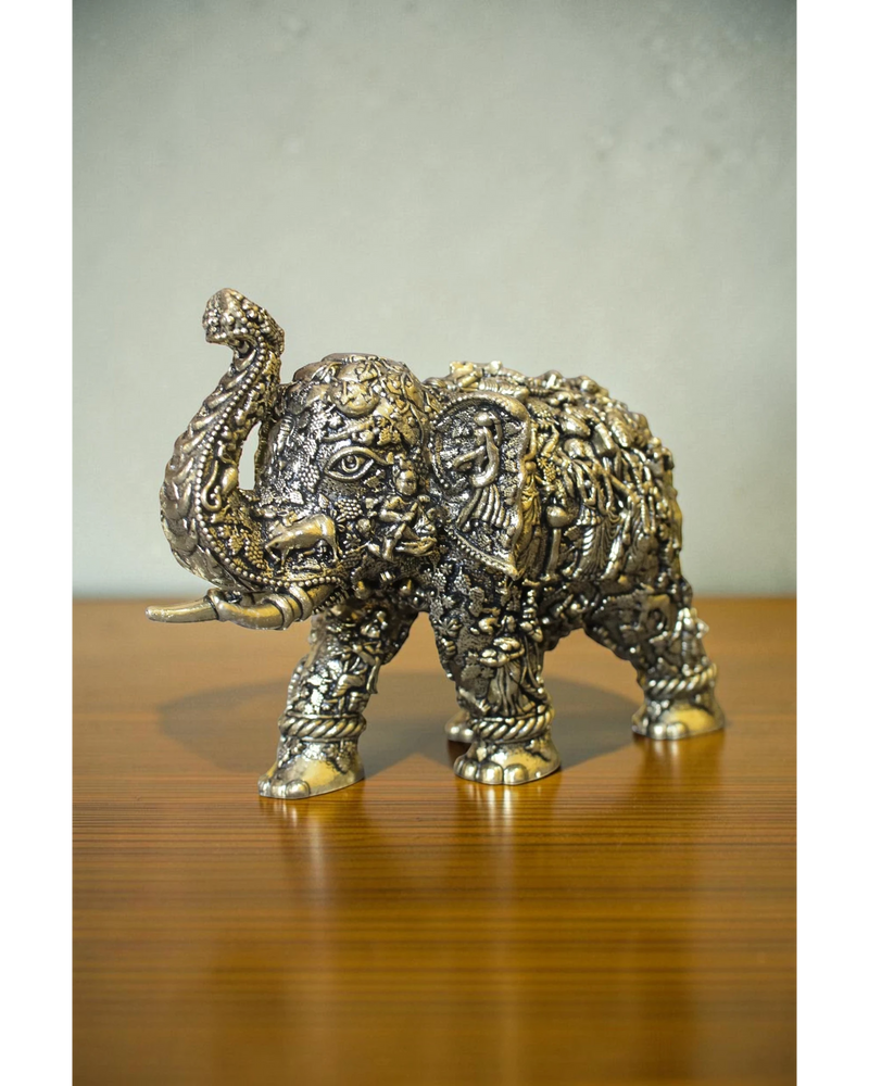 Rigvedaa brass elephant statue with intricate Radha Krishna murals, golden finish, detailed craftsmanship for puja and decor.