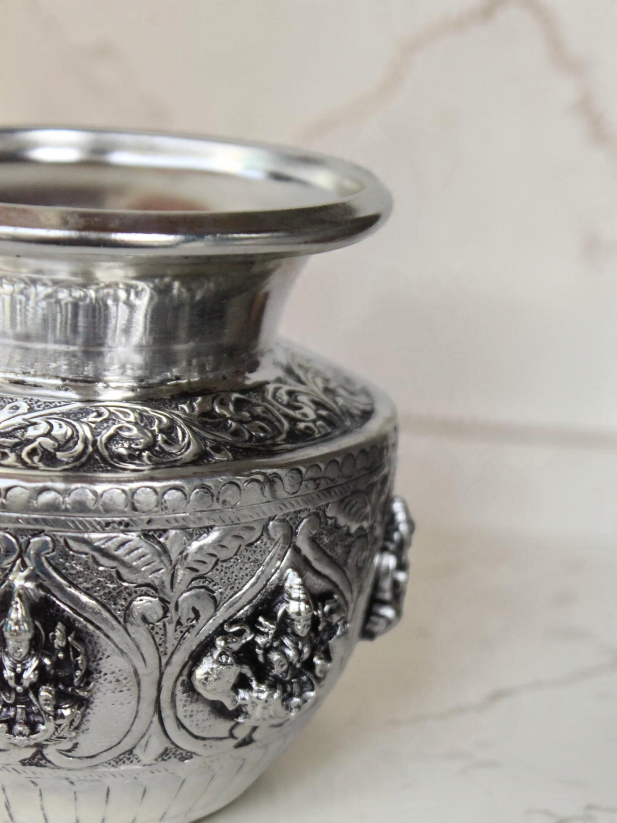 Rigvedaa™ 999 silver plated brass Ashta Lakshmi Kalash with intricate embossed floral and deity relief work