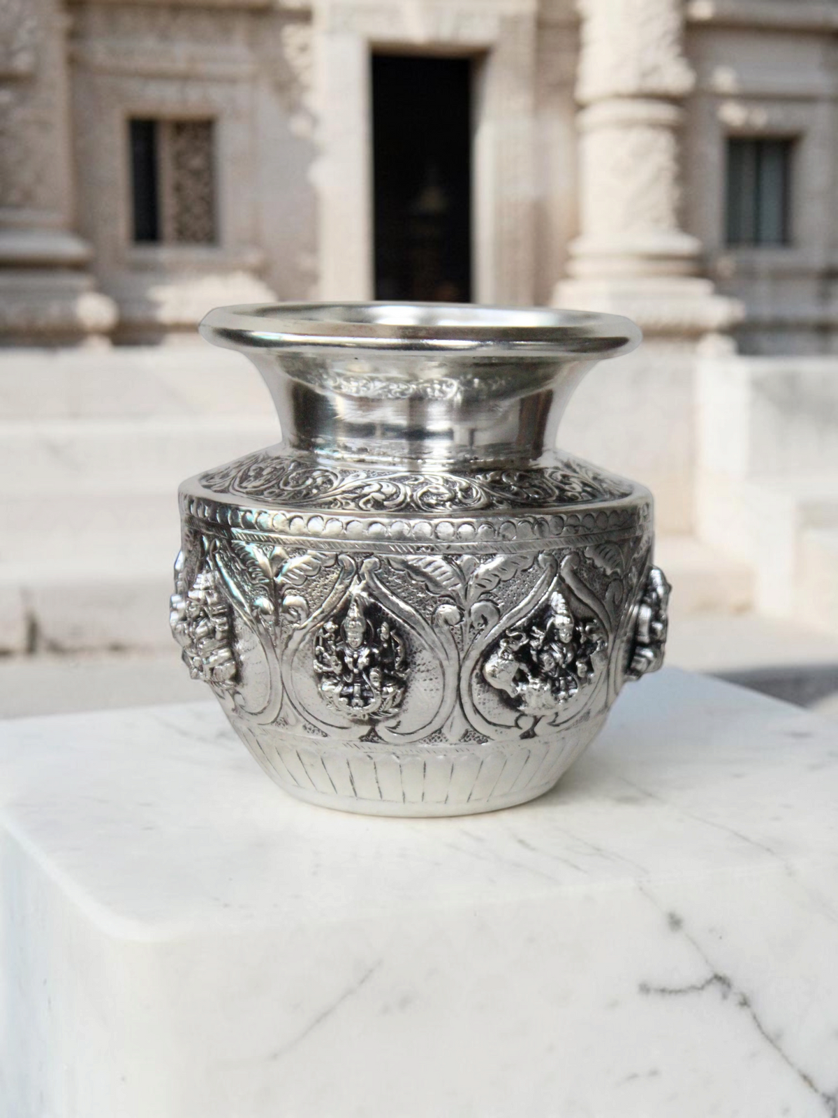 Rigvedaa™ 999 silver plated brass Ashta Lakshmi Kalash with intricate embossed floral and deity relief for pooja