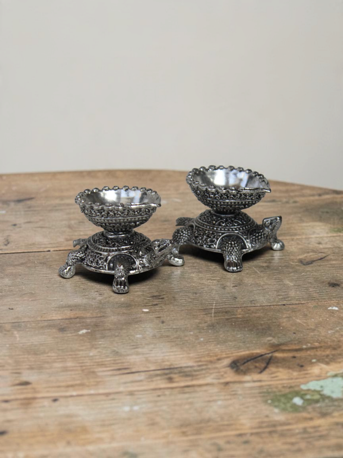 Rigvedaa™ silver-toned turtle shaped diya oil lamp holders with intricate traditional metal detailing