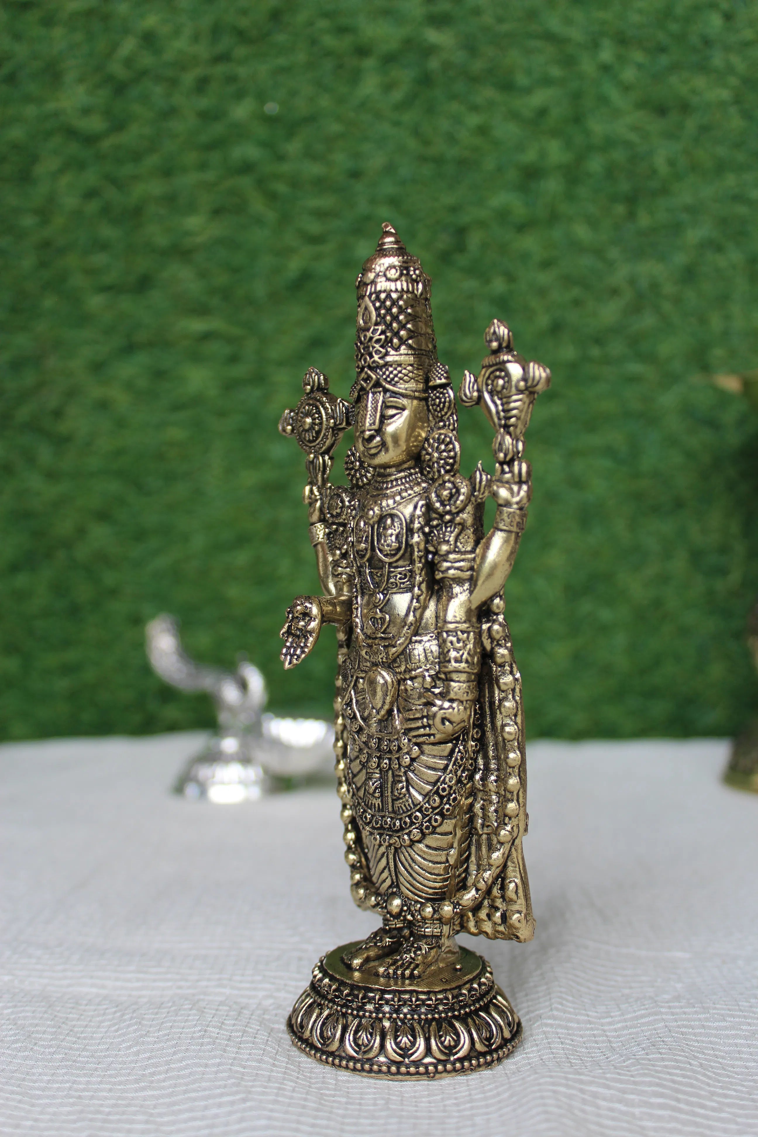 Side angle view of Tirupati Balaji brass idol showing intricate jewellery and divine attire – pure brass Lord Venkateshwara murti for home temple